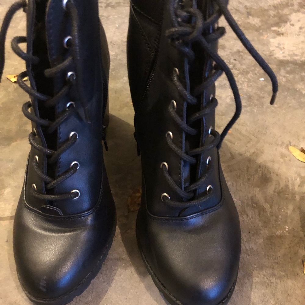 Black heeled side zipper booties